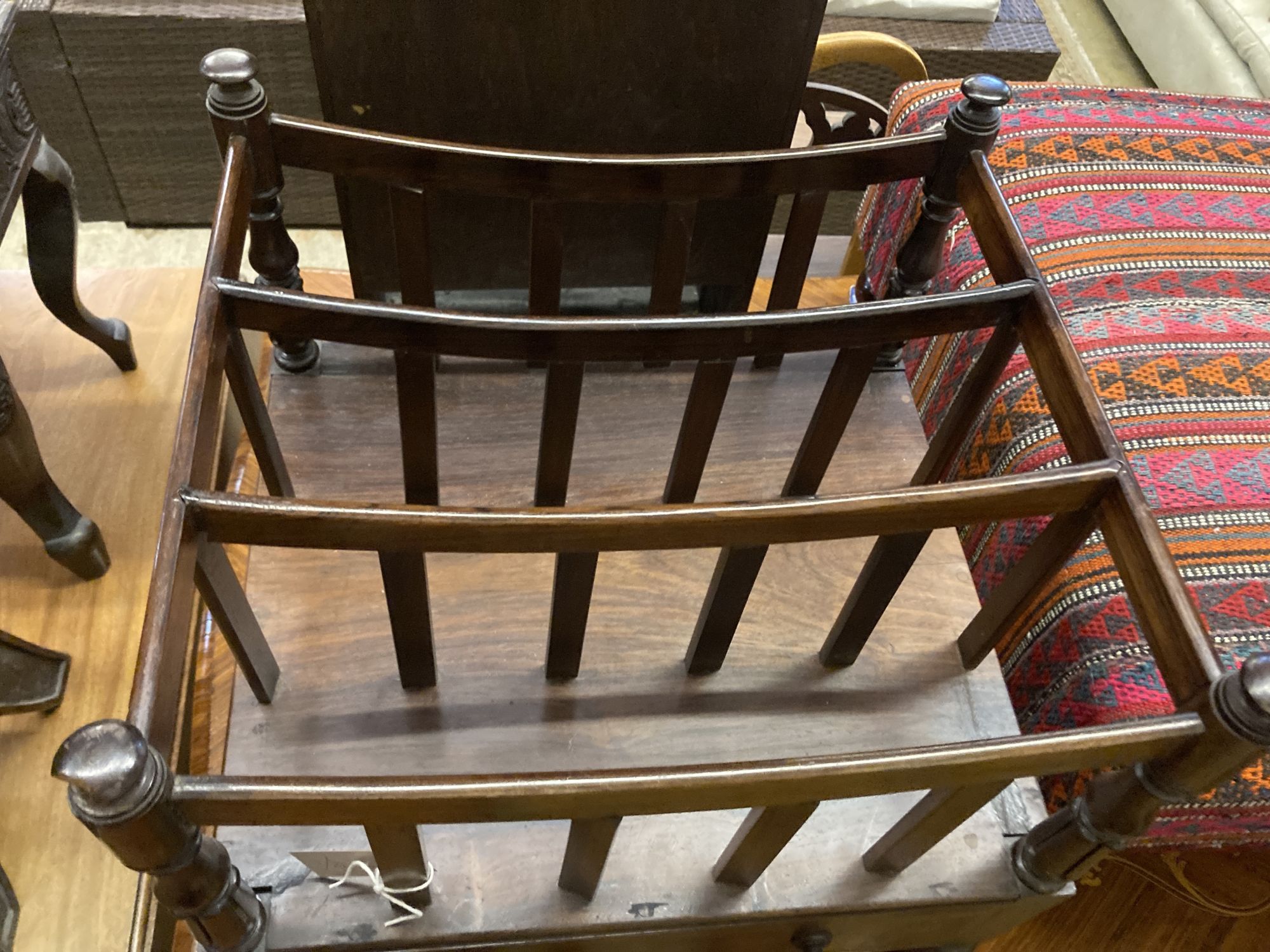 An early Victorian rosewood Canterbury, width 48cm, depth 43cm, height 56cm